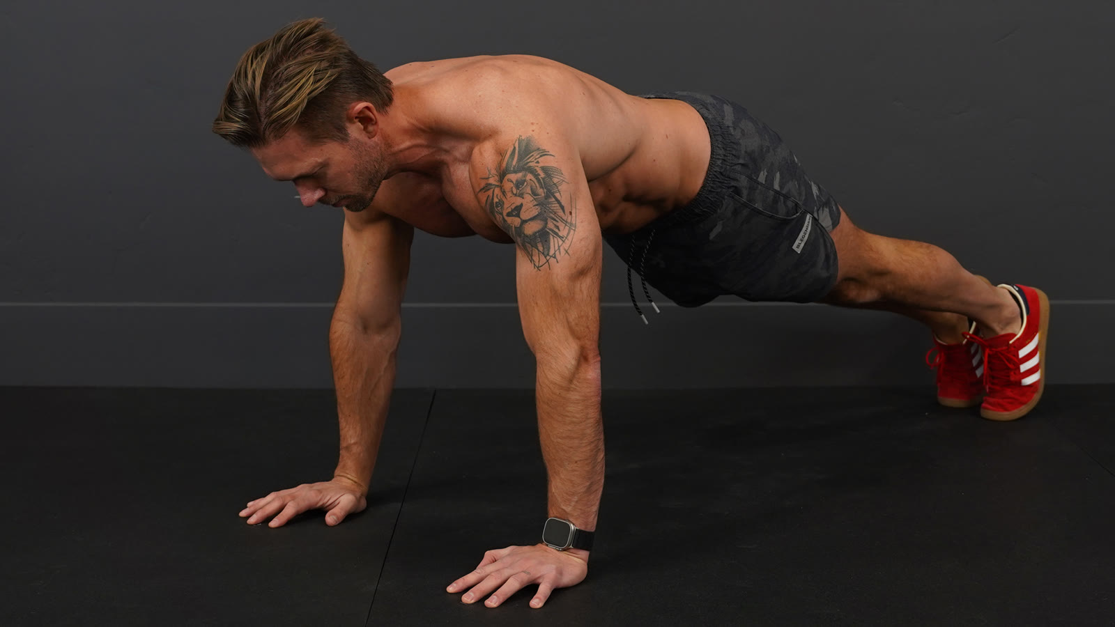 Dan at the top of a push up: arms straight, body in one line